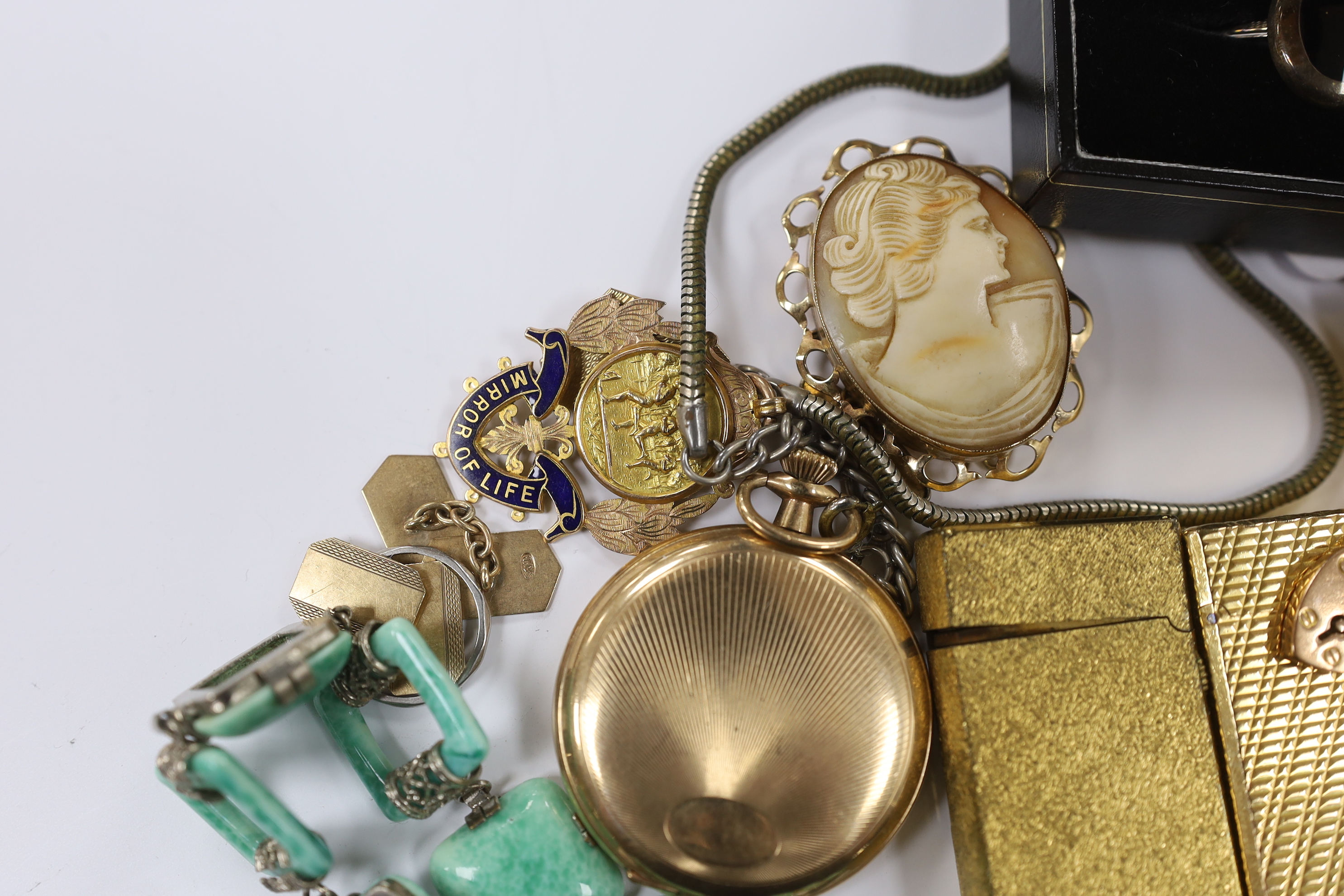 A pair of 9ct gold cufflinks, one other 9ct cufflink, a 9ct mounted cameo shell brooch, a gold plated pocket watch, with a 9ct gold medallion, a small platinum wedding band, a 9ct and synthetic colour change corundum dre